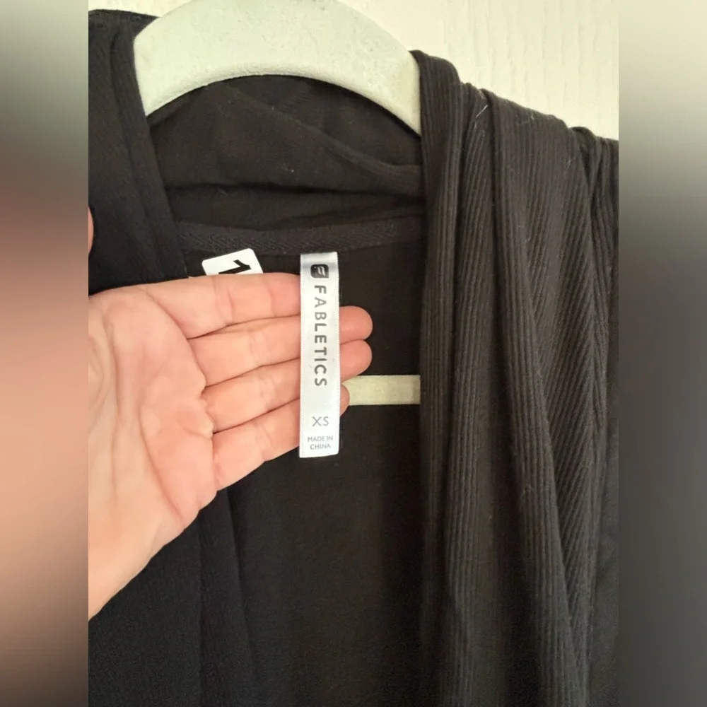 Fabletics wrap type cardigan. Size CS would for sure fit S and probably a medium